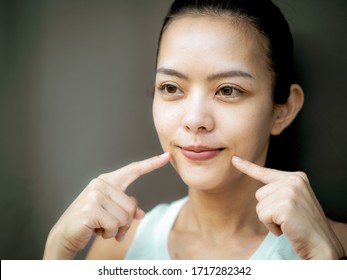 Beautiful Young Asian Woman Doing Face Yoga Poses