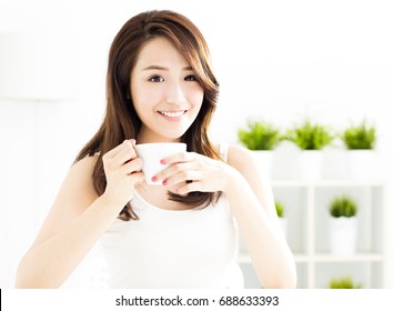 Beautiful Young Asian Woman Drinking Coffee