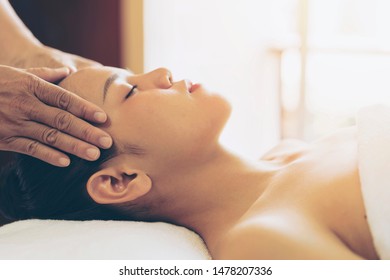 Beautiful Young Asian Woman Enjoying Spa, Massage Head While Relax In Spa Salon Center Hotel. Wellness, Woman And Beauty Concept