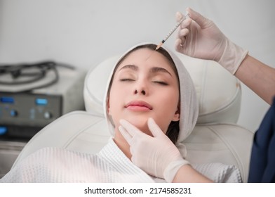 Beautiful Young Asian Woman Getting Cosmetology Treatment Facial Skin Injection By Doctor Beautician In Beauty Clinic. Female Making Mesotherapy Beauty Care With Anti-aging Of Face In Surgery Clinic.