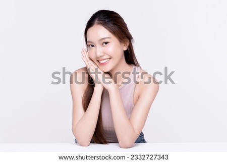 Beautiful young Asian woman with healthy and perfect skin on isolated white background. Facial and skin care concept for commercial advertising.