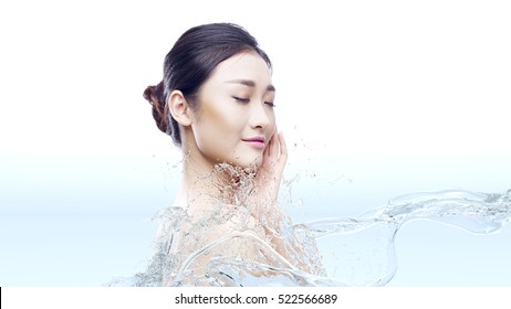 Beautiful Young Asian Woman With Perfect Skin In Splashes Of Water