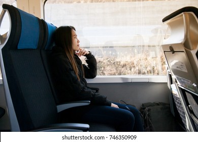 Beautiful Young Asian Woman Sitting On The Express Train From Narita Airport Go To Downtown Tokyo ,Japan