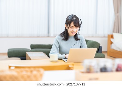 Beautiful young asian woman studying with a laptop computer,correspondence course - Shutterstock ID 2027187911