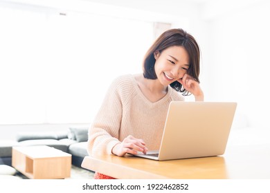 Beautiful Young Asian Woman Using Laptop