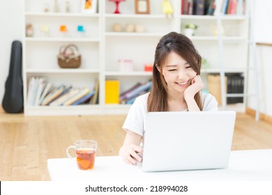 Beautiful Young Asian Woman Using Laptop