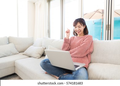 Beautiful Young Asian Woman Using Laptop