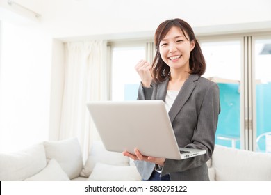 Beautiful Young Asian Woman Using Laptop