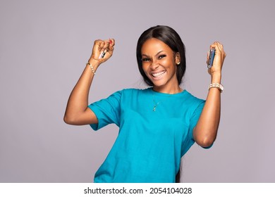 beautiful young black woman rejoicing, advertising concept - Shutterstock ID 2054104028