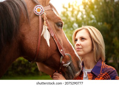 Beautiful Young Blond Woman With A Horse, Portrait. The Concept Of Love For Nature, Human Interaction With Nature And Animals.