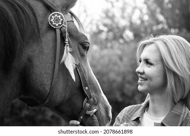 Beautiful Young Blond Woman With A Horse, Portrait. The Concept Of Love For Nature, Human Interaction With Nature And Animals.