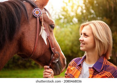 Beautiful Young Blond Woman With A Horse, Portrait. The Concept Of Love For Nature, Human Interaction With Nature And Animals.