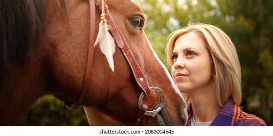 Beautiful Young Blond Woman With A Horse, Portrait. The Concept Of Love For Nature, Human Interaction With Nature And Animals.