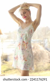 Beautiful young blonde woman in home dress - Shutterstock ID 2241176291
