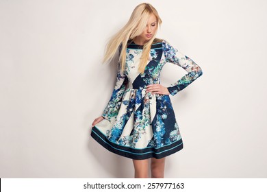 Beautiful Young Blonde Woman In Nice Spring Dress, Posing In Studio. Fashion Photo