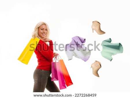 Beautiful young blonde woman, shopping photomanipulation , clothes flying around