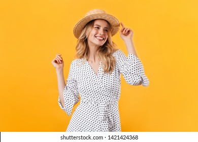 Beautiful Young Blonde Woman Wearing Summer Dress Standing Isolated Over Yellow Background