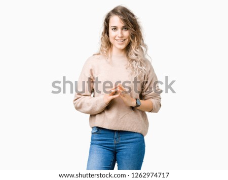 Beautiful young blonde woman wearing sweatershirt over isolated background Hands together and fingers crossed smiling relaxed and cheerful. Success and optimistic