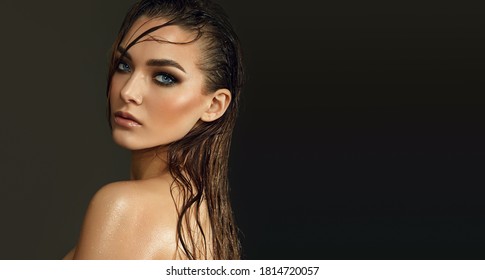 Beautiful Young Blue-eyed Woman With Wet Skin And Wet Hair In The Studio On A Gray Background. Close-up Portrait.