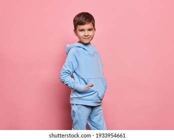 Beautiful Young Boy Wear Of Blue Set Of Track Suit Isolated On Pink Background