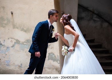 Beautiful Young Bride With Wedding Bouquet And Groom Near Old Castle Before Wedding Ceremony