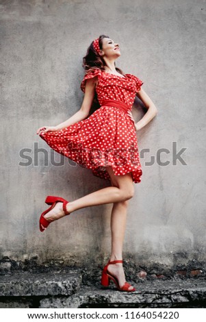 
Beautiful young brunette girl in style pin-up.
A spicy brunette travels in a new city.
The concept of carefree pastime.