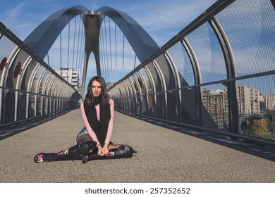 Beautiful Young Brunette With Over The Knee Boots Posing On A Bridge