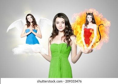 Beautiful young brunette woman choosing between angel and devil