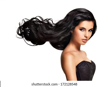 Beautiful   Young Brunette Woman With Long Black Curly  Hair Posing At Studio