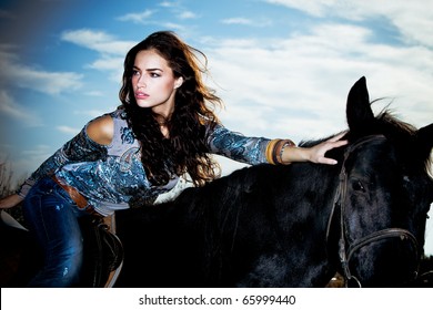 Beautiful Young Brunette Woman  Ride Black Horse