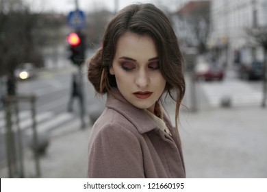 Beautiful Young Business Woman In The City Looking Down