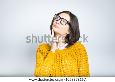 beautiful young business woman dreaming, wearing glasses, isolated photo on background