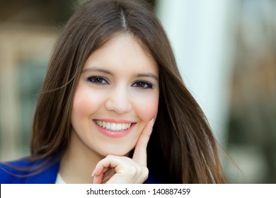 Beautiful young businesswoman portrait in an urban setting - Shutterstock ID 140887459