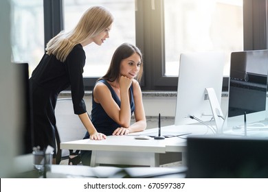 Beautiful Young Bussines Women Working Together In The Office On A Computer