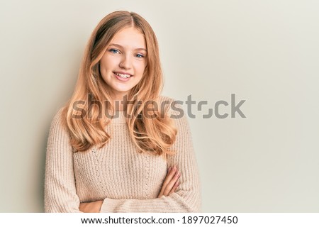 Beautiful young caucasian girl wearing casual clothes happy face smiling with crossed arms looking at the camera. positive person. 