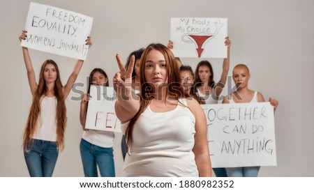 Women showing poster with metoo hashtag