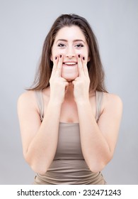 Beautiful Young Caucasian Woman Doing Face Yoga Pose