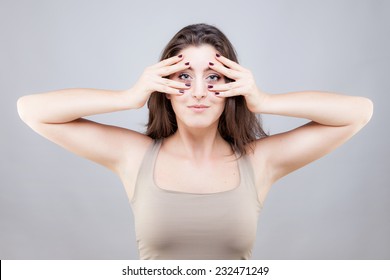 Beautiful Young Caucasian Woman Doing Face Yoga Pose