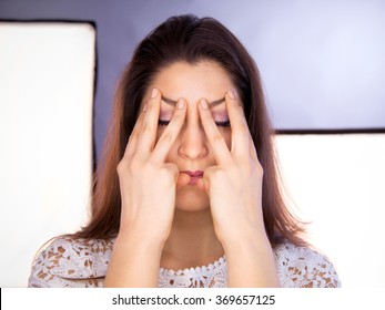 Beautiful Young Caucasian Woman Doing Face Yoga