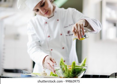 Beautiful Young Chef Woman Prepare And Decorating Tasty Food In Kitchen