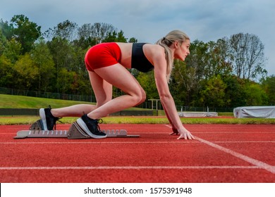 A Beautiful Young College Athlete Prepares Herself For A Track Meet At A Local University 