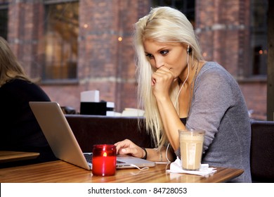 Beautiful Young College Student On A Cafe.