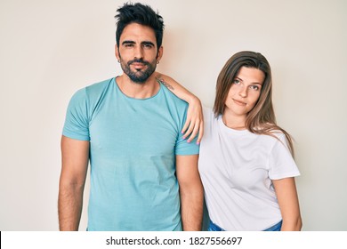 Beautiful Young Couple Of Boyfriend And Girlfriend Together Looking Sleepy And Tired, Exhausted For Fatigue And Hangover, Lazy Eyes In The Morning. 