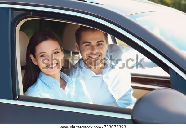 Beautiful young couple in\
car