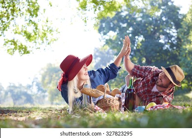 Beautiful Young Couple Having Picnic in Countryside. Happy Famil - Shutterstock ID 327823295