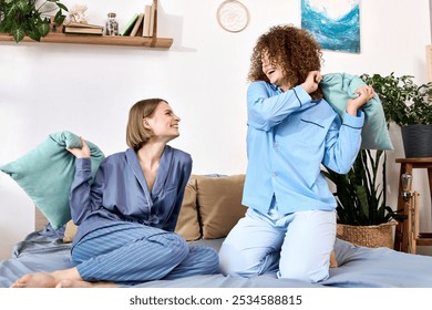 A beautiful young couple joyfully engages in a playful pillow fight, sharing laughter and love. - Powered by Shutterstock