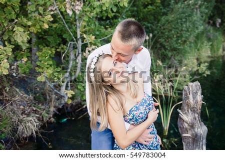 Beautiful young couple near the water.