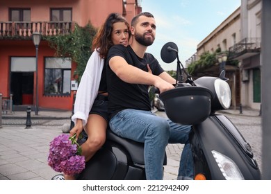 Beautiful Young Couple Riding Motorcycle On City Street