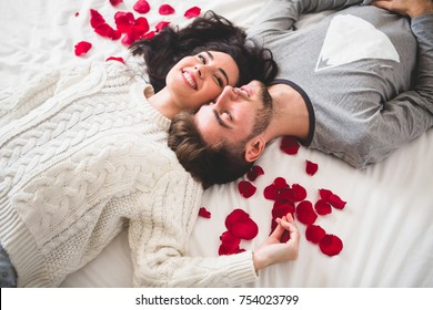 Beautiful Young Couple With Rose