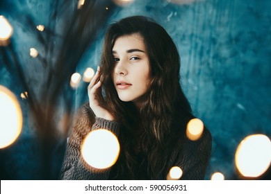 Beautiful Young Elegance Girl Creative Portrait In Dark Room With Bokeh Lights Blur Effect, Low Light Photography. Dreaming Concept